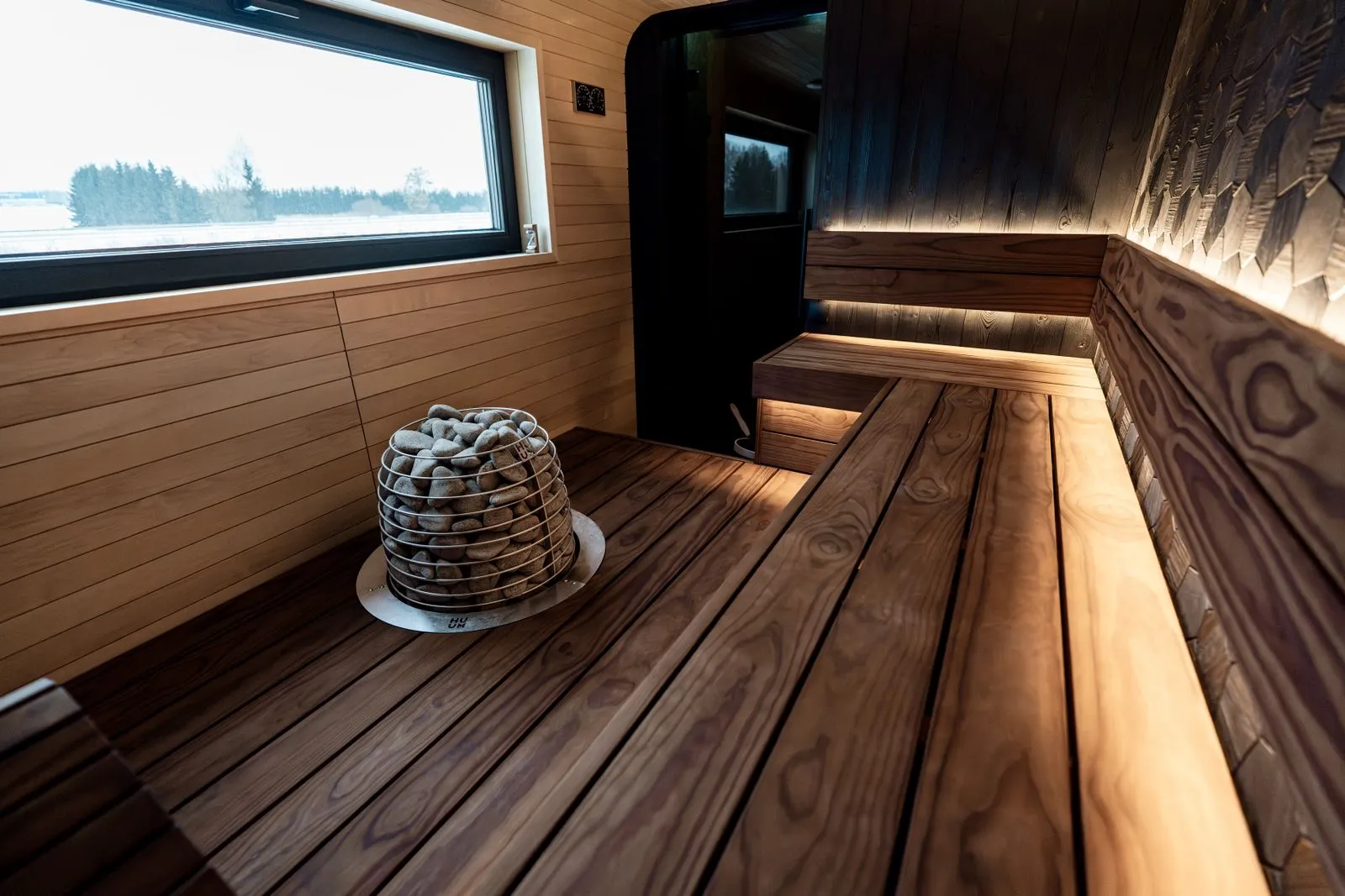 Experience a sleek Nordic sauna interior with modern wood design and LED lighting.